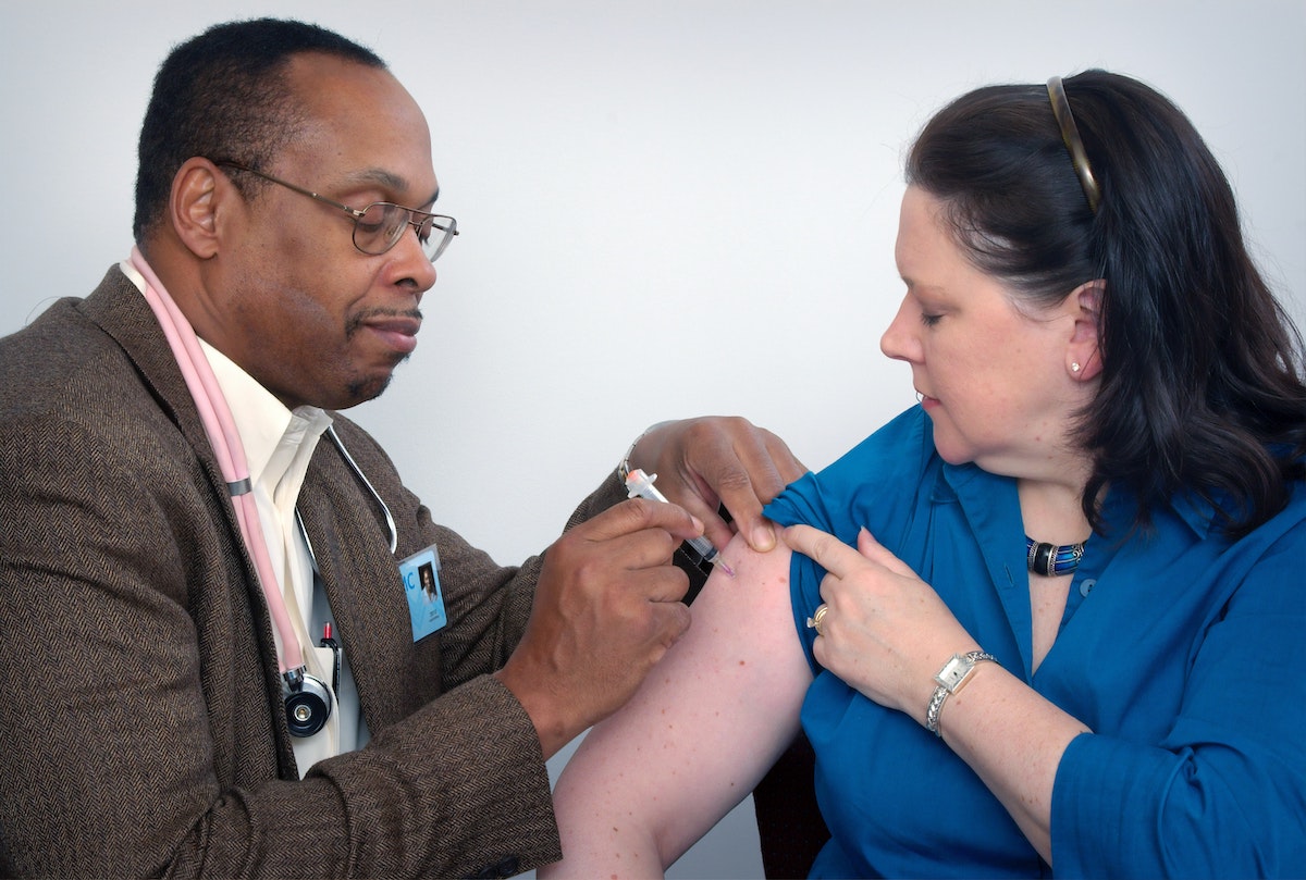 Doctor Injecting Vaccine