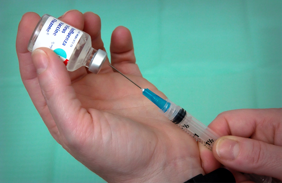 flu vaccine bottle with syringe