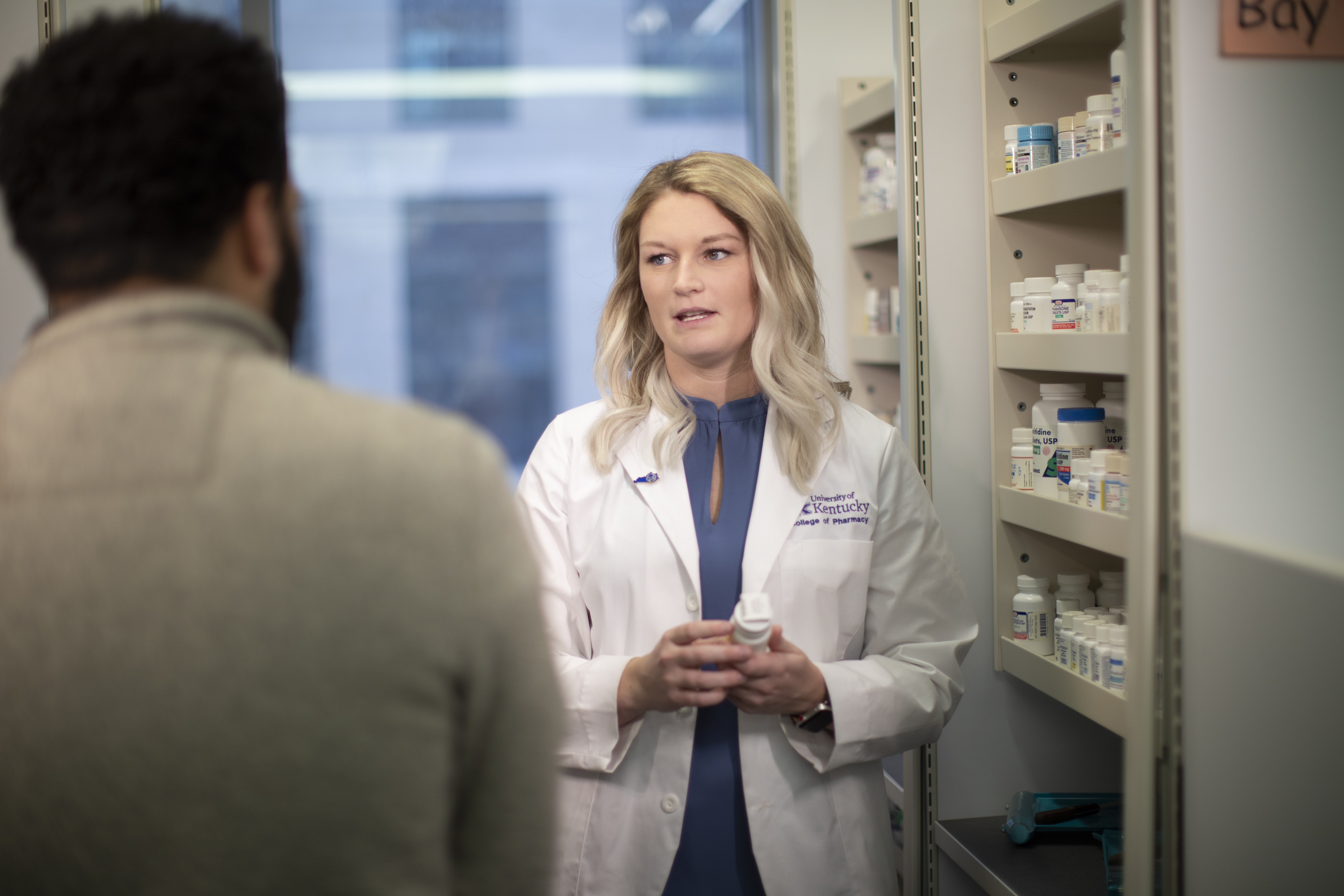 pharmacy student talking to patient