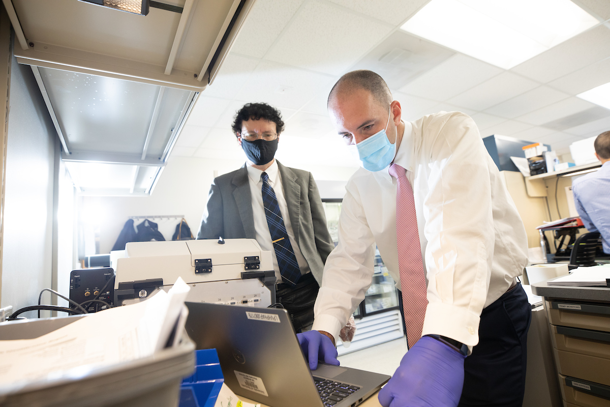 Rob Lodder, left,  and Phil Almeter are doing a drug quality study to identify impurities in injectable drugs.  They use infrared technology to detect impurities on September 29, 2020.