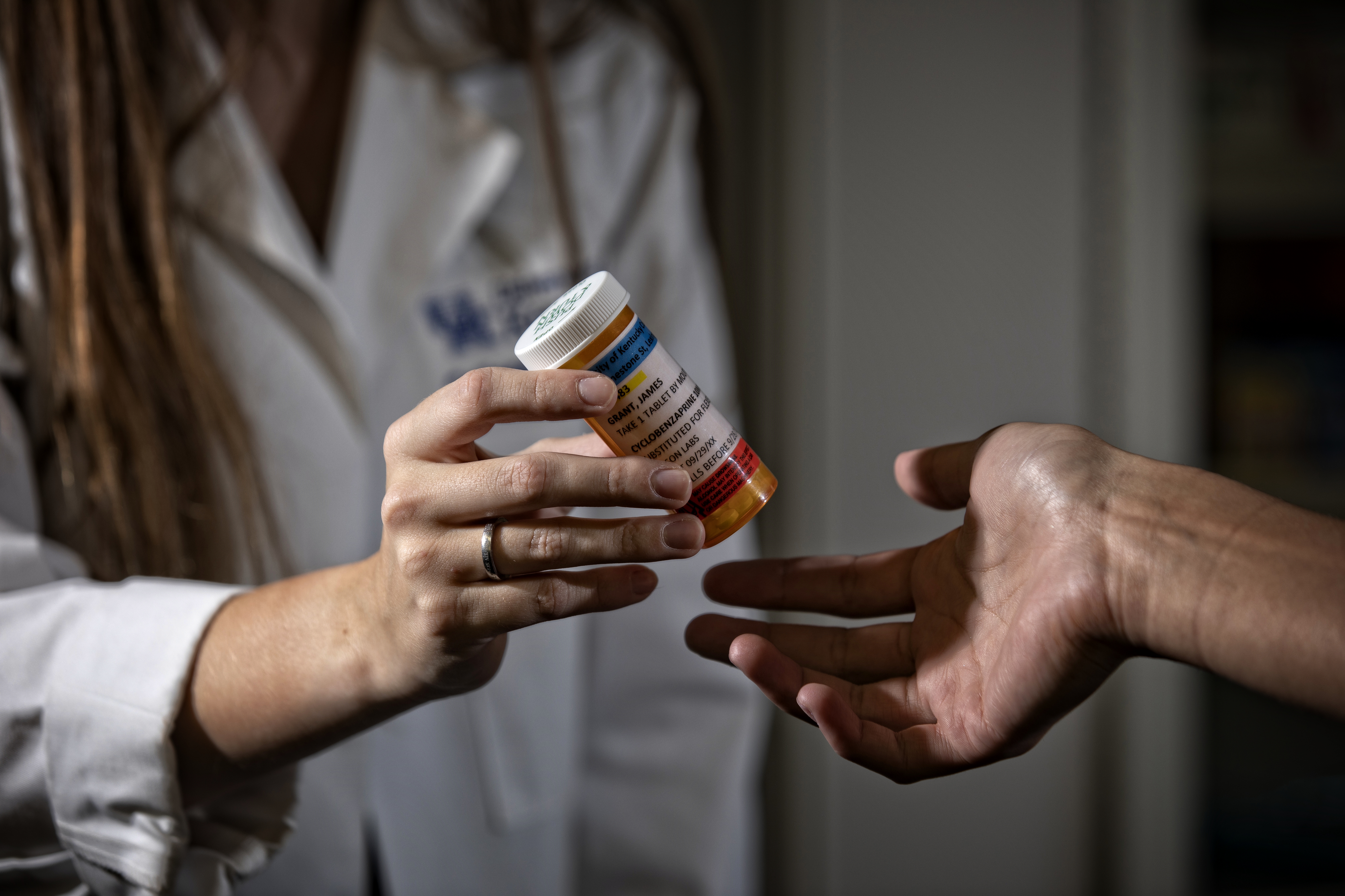 Pharmacist working with patient