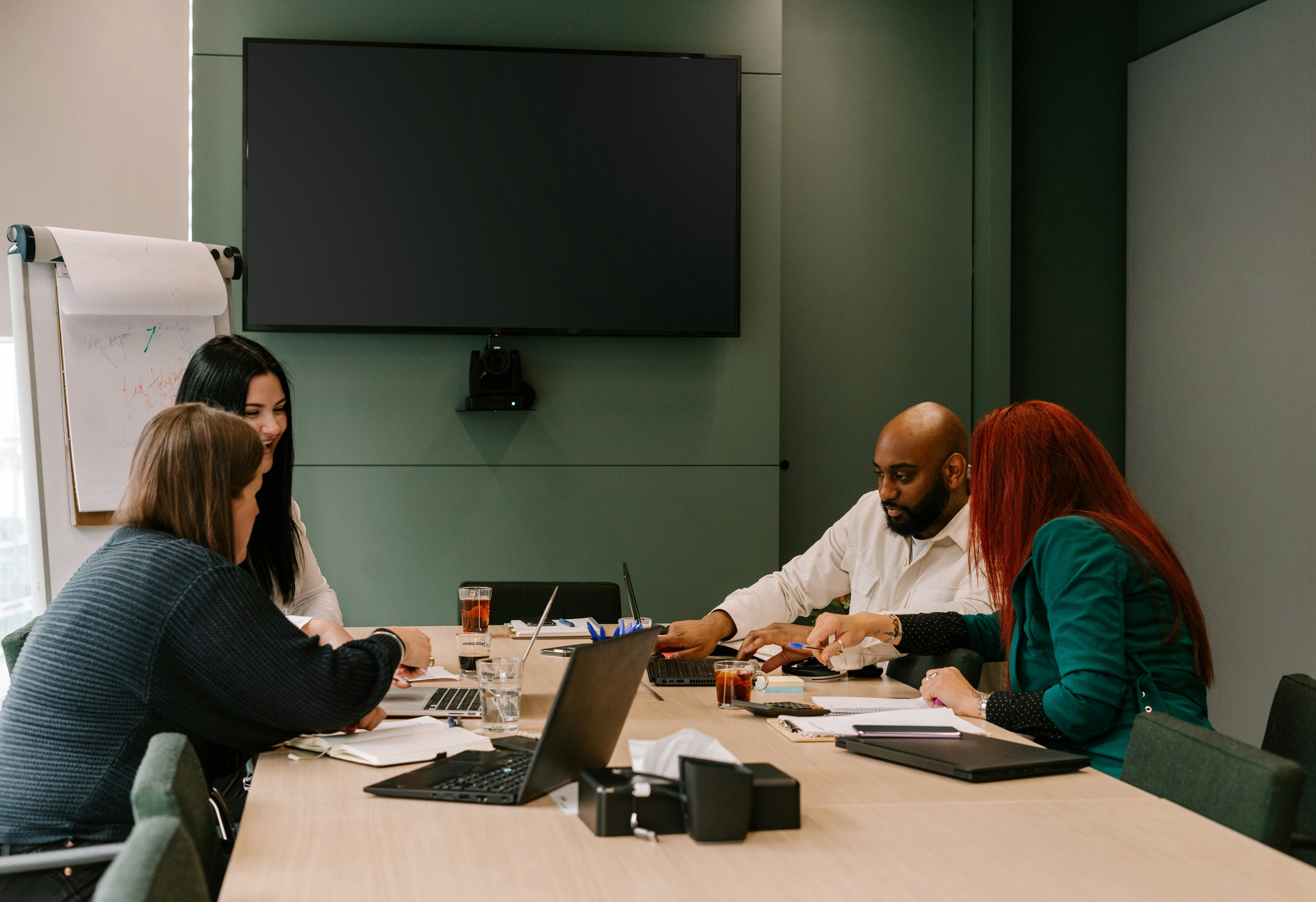 people sitting around a conference room table