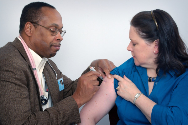 Doctor Injecting Vaccine