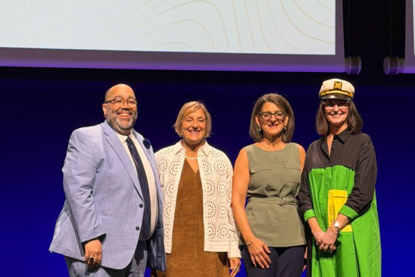 Group photo of Dr. Moga on stage with ISPE leadership