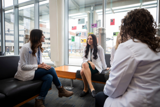 Students sitting with White Coats