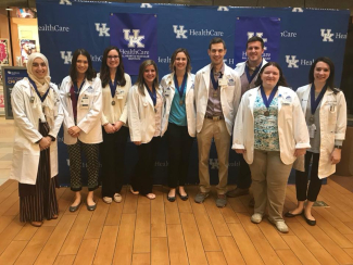 students standing together in white coats