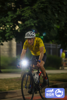 man riding bike at night