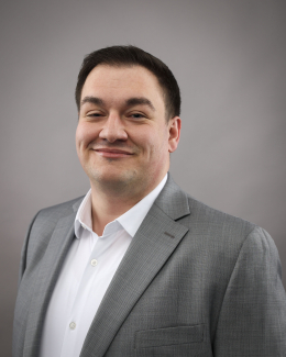 headshot of man in suit