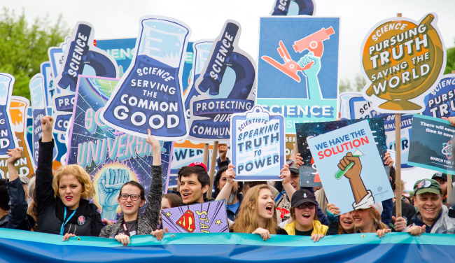 Scientists marching with signs