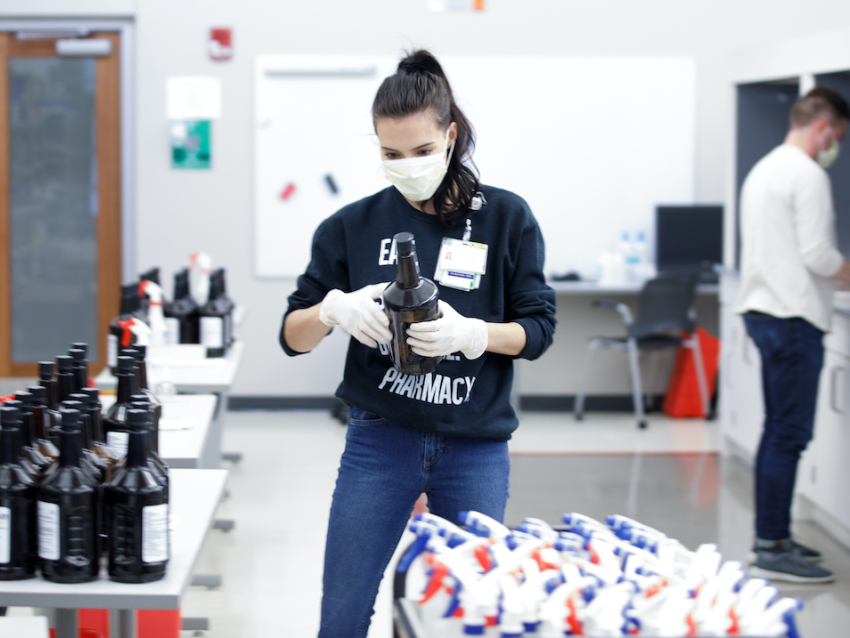 Student making hand sanitizer 