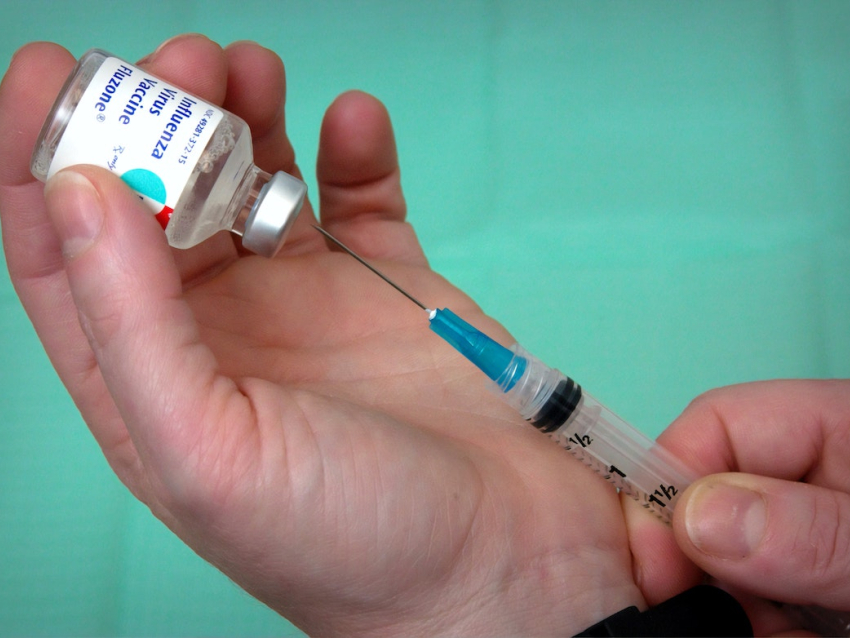 flu vaccine bottle with syringe
