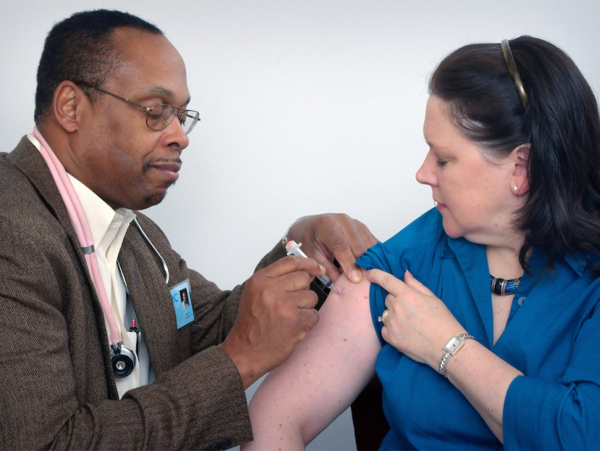 Doctor Injecting Vaccine