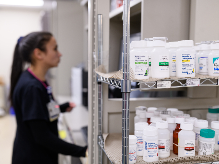 Resident standing next to meds