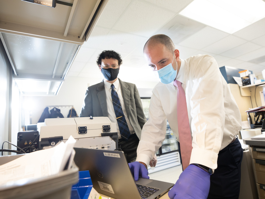 Rob Lodder, left, and Phil Almeter are doing a drug quality study to identify impurities in injectable drugs. They use infrared technology to detect impurities on September 29, 2020.