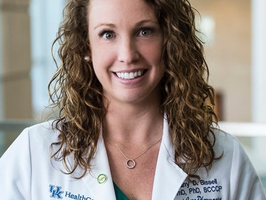 Brittany Bissell wearing a white coat in the TODD Building