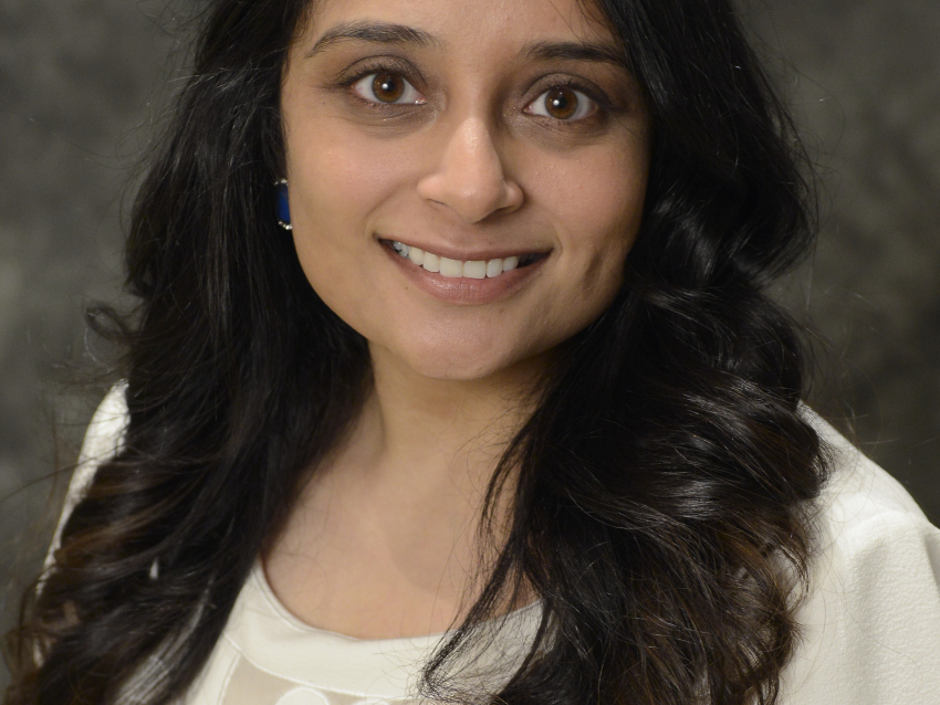 a professional headshot of Urvi Patel