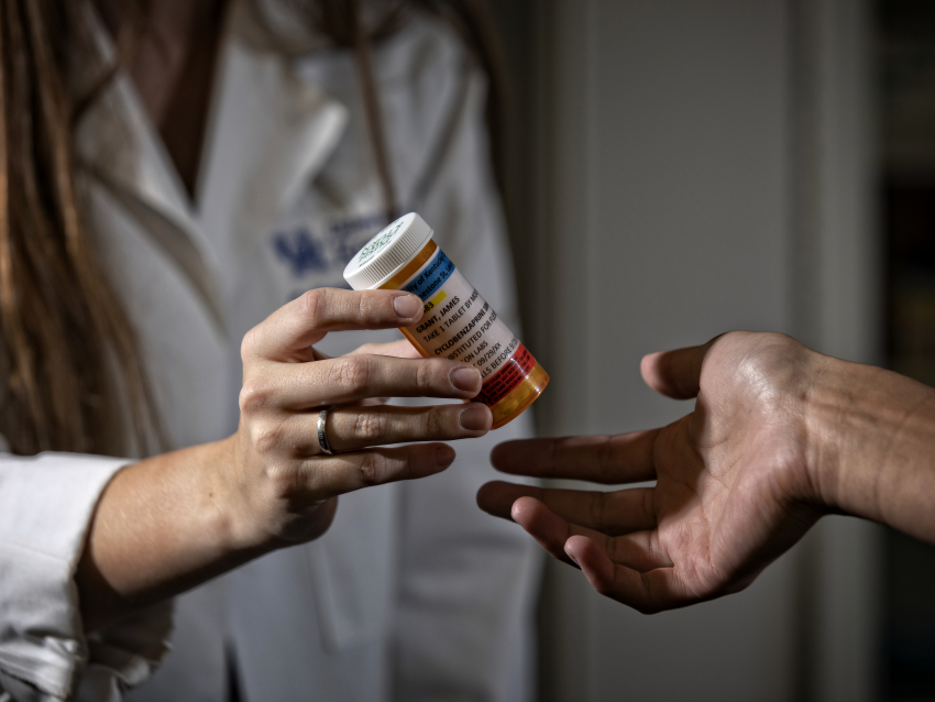 Pharmacist working with patient