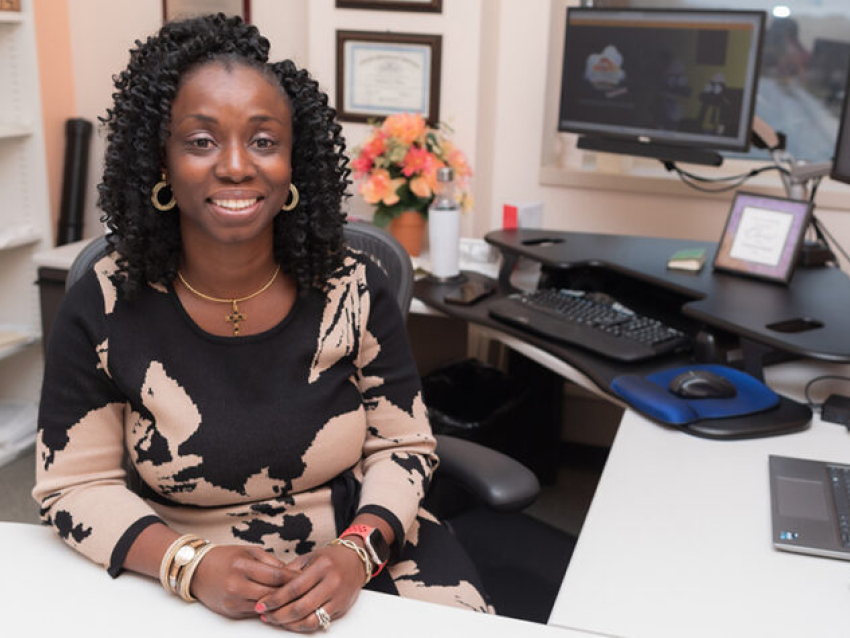 Abraham poses in her office