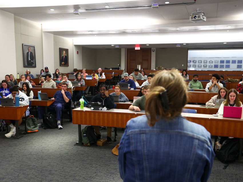 professor lecturing in a pharmacy classroom