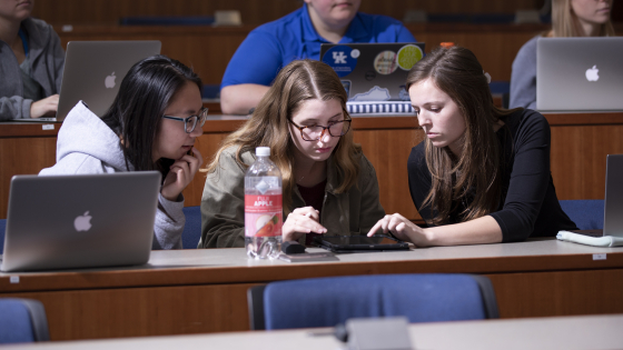 students talking together in class