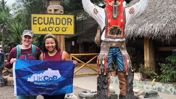 students holding UKCOP flag in ecuador