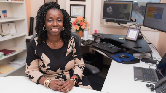 Abraham poses in her office