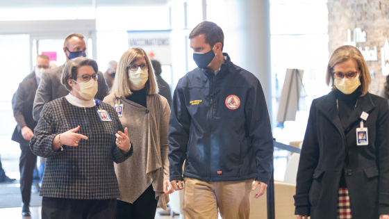 Melinda Joyce and speaks with Governor Andy Beshear