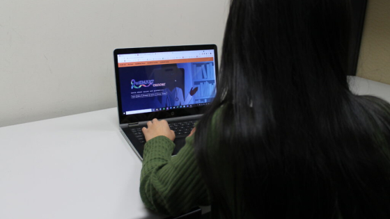 woman playing game on chromebook