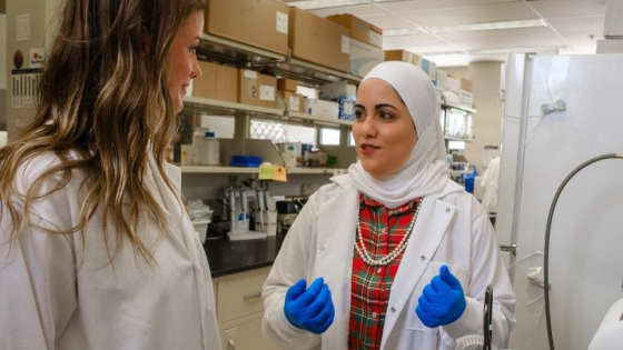 Yosra Helmy in lab with female scientist