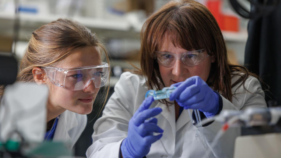 Dr. Martha Grady and student researcher in lab