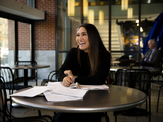 student in student center studying