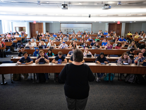 pharmacy professor teaching looking out into full class of students