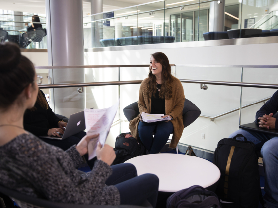 students sitting in circle laughing