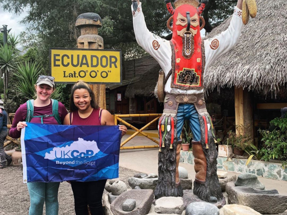 students holding UKCOP flag in ecuador