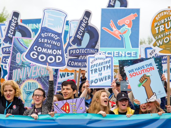 Scientists marching with signs