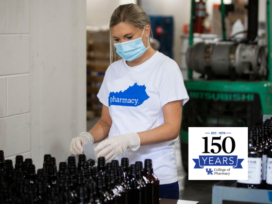 student with mask bottling sanitizer