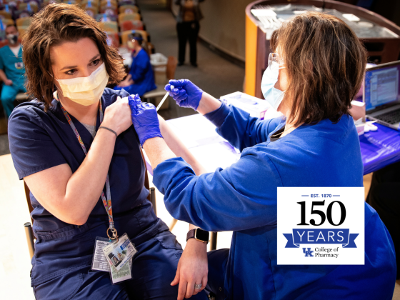 Abby Bailey, Emergency medicine pharmacist gets her vaccination from UK Health services nurse Janie Lawson, RN, as UK administered its first round of Covid-19 vaccine on December 15, 2020