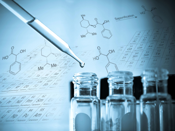 Pipette and bottles with chemical structures in background