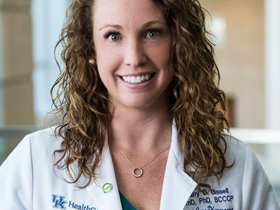 Brittany Bissell wearing a white coat in the TODD Building
