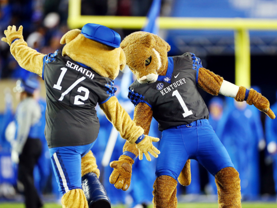 UK mascots high-fiving on football field