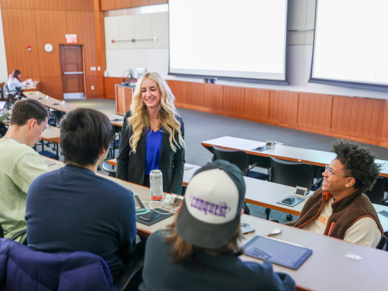 Woman talking with students
