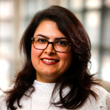 woman wearing glasses and smiling