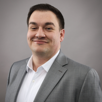 headshot of man in suit