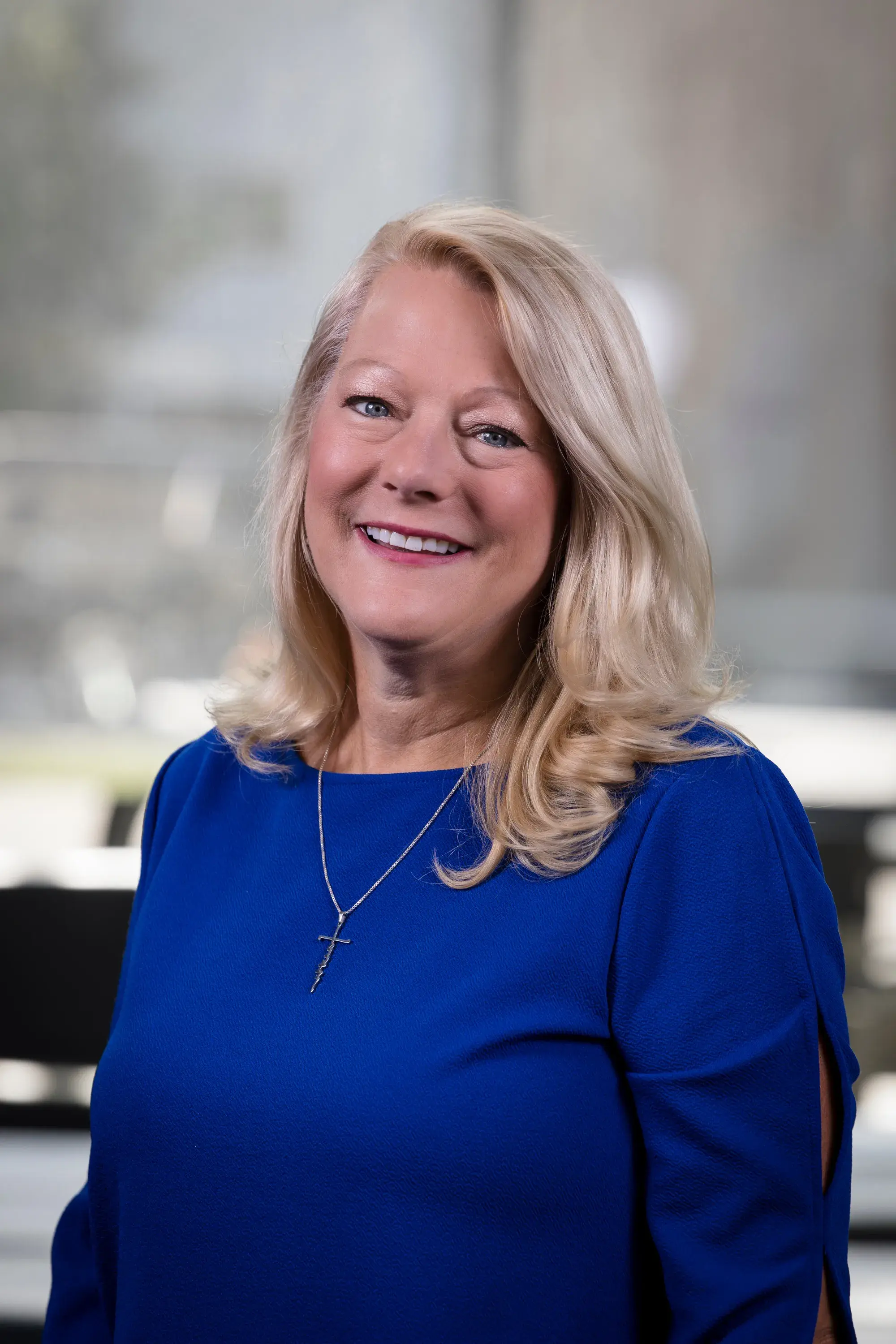 woman wearing blue smiling